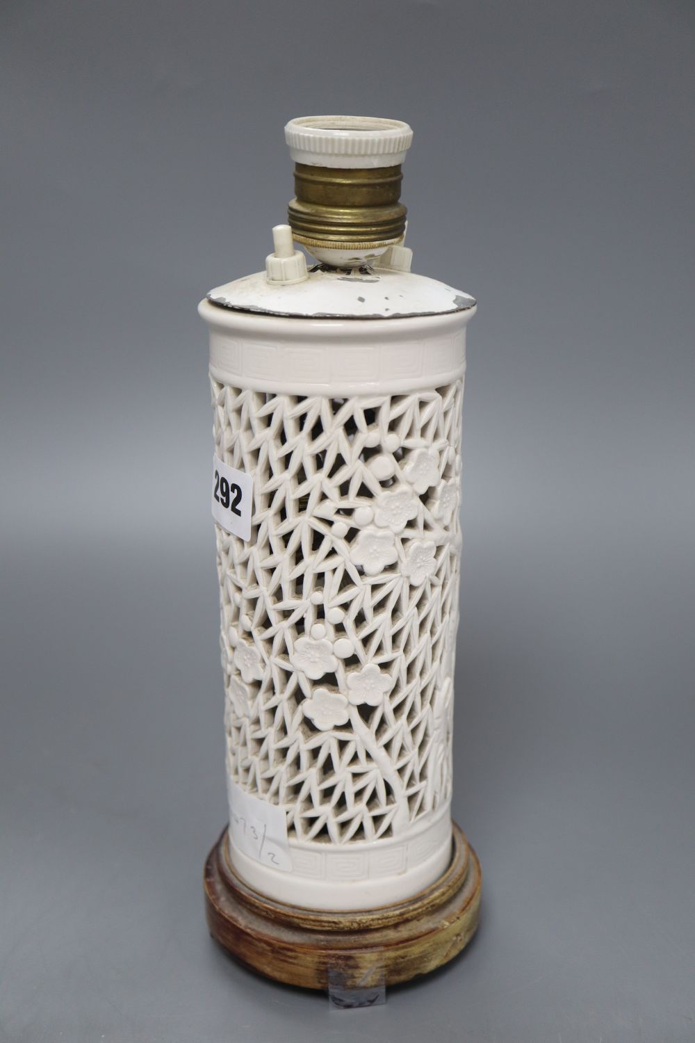 A pierced Chinese blanc de chine lamp base, height 23cm excl. fittings